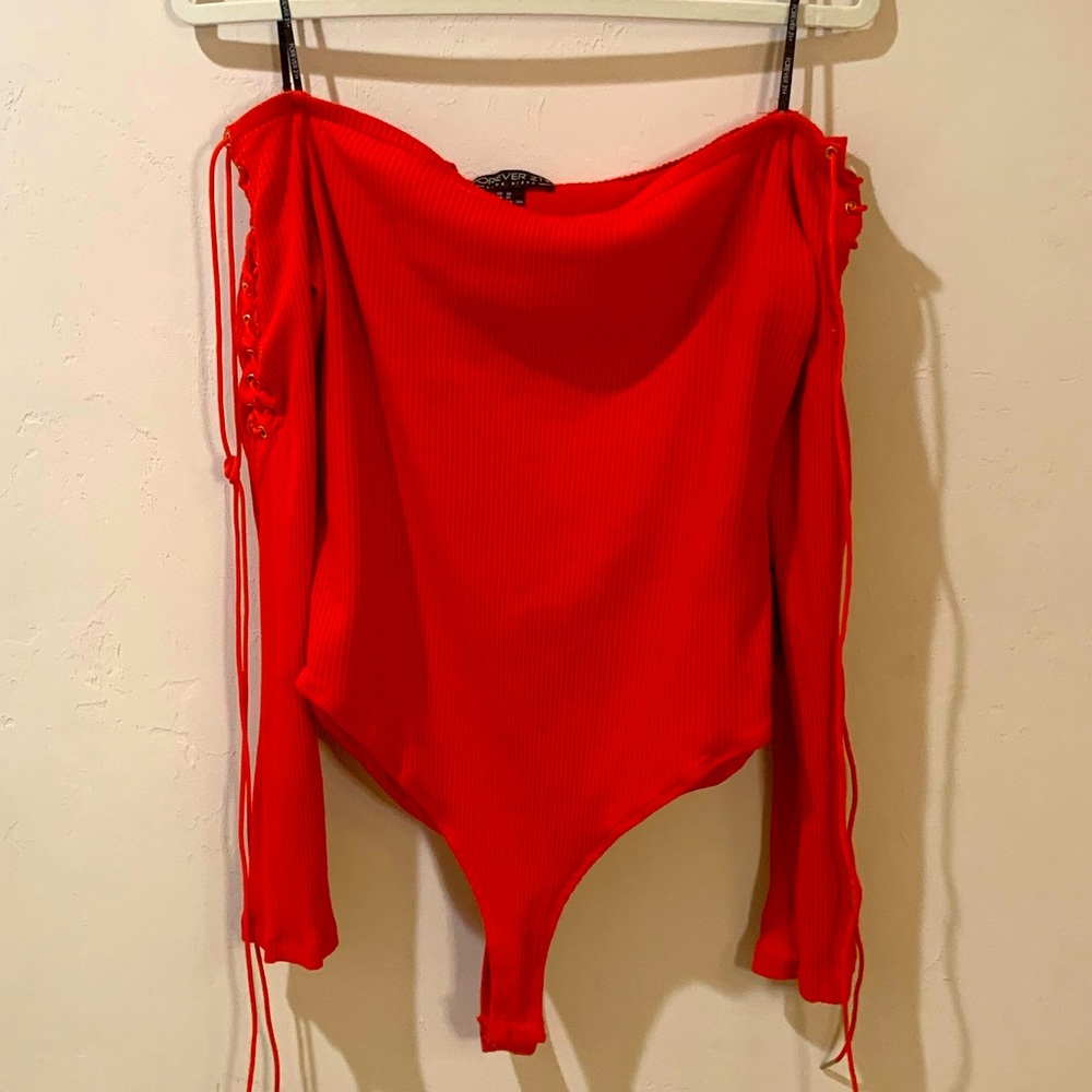 Orange-Red off the shoulder ribbed bodysuit.